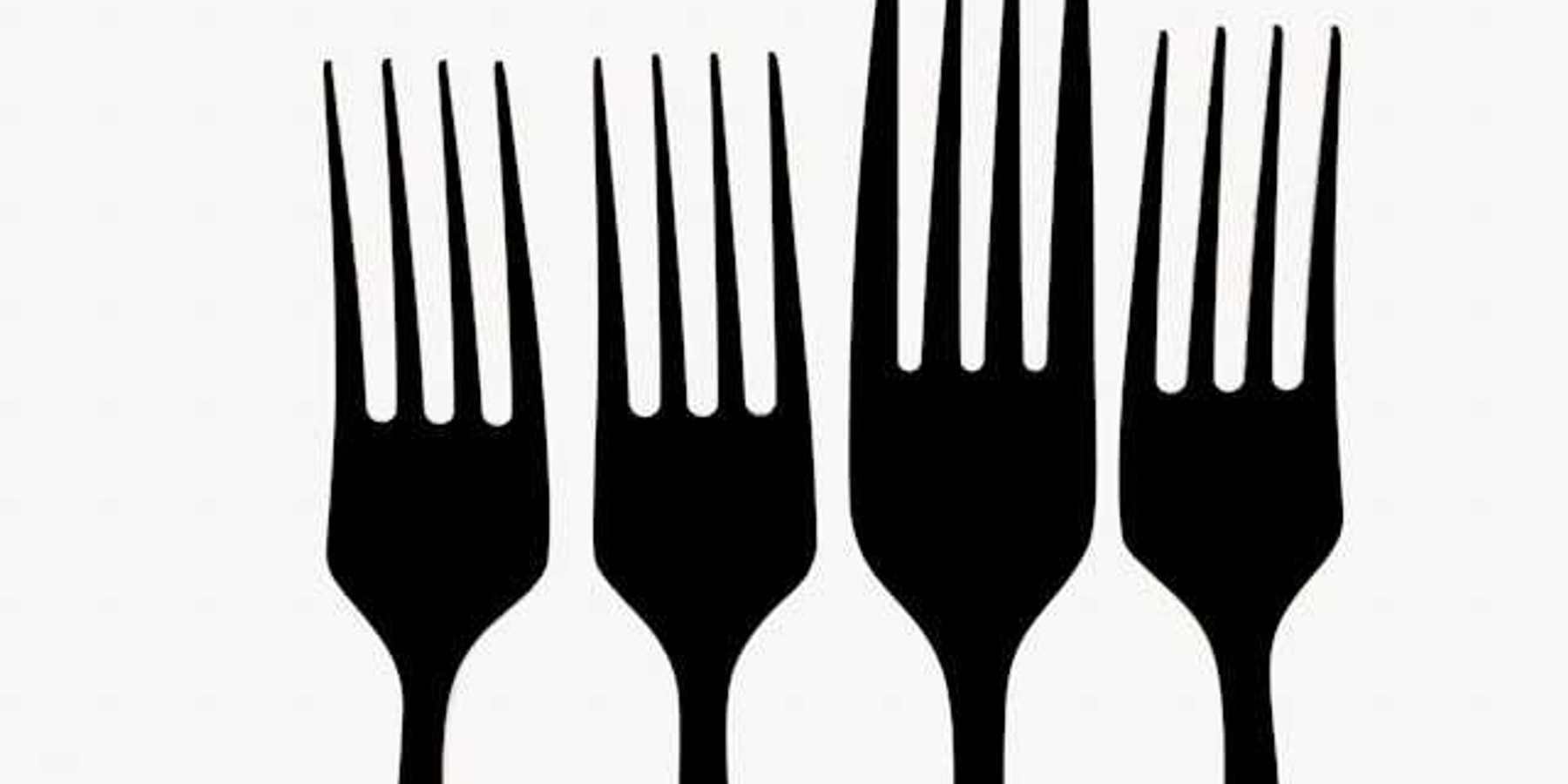 A row of forks against a white background