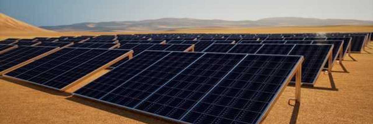 A row of solar panels in a desert environment