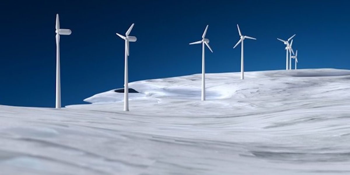 A row of wind turbines on a frozen hill.