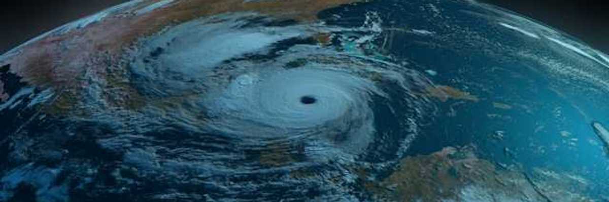 A satellite view of the earth showing a swirling hurricane off the Gulf Coast