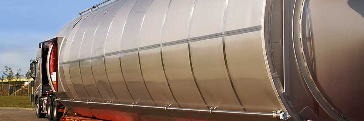 A semi truck hauling a large gas container