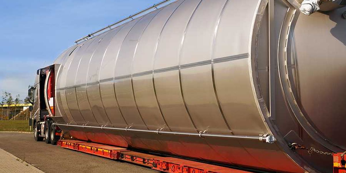 A semi truck hauling a large gas container