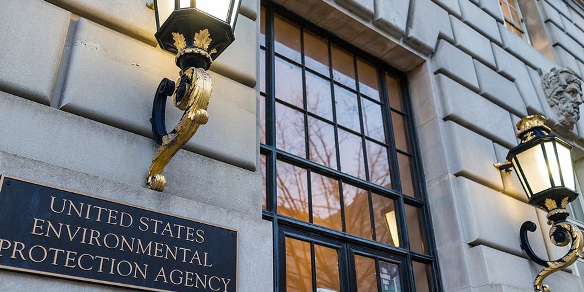 A sign saying Environmental Protection Agency on a gray building.
