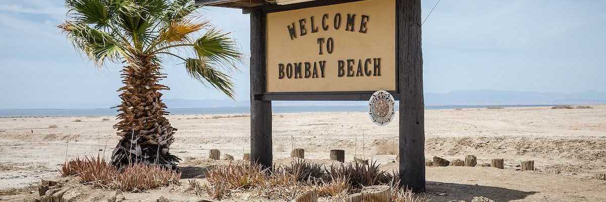 A sign welcomes visitors to Bombay Beach, a partially abandoned town on the shores of the Salton Sea.