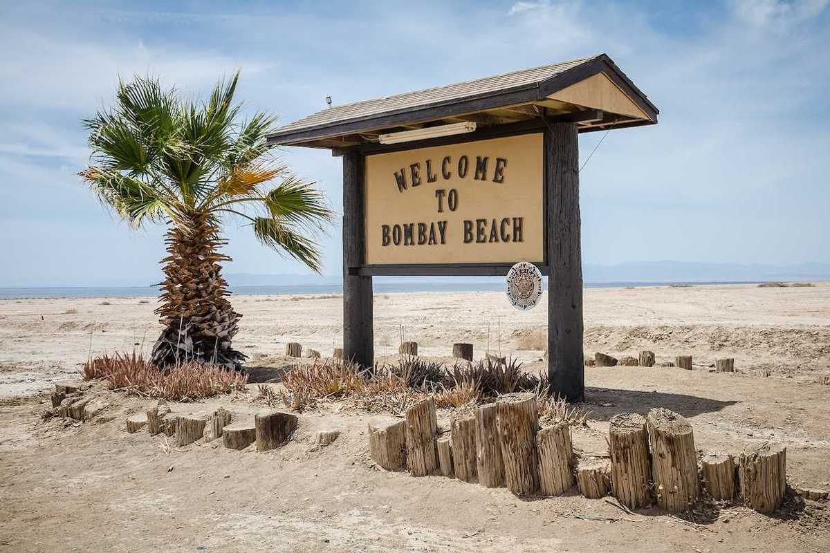 A sign welcomes visitors to Bombay Beach, a partially abandoned town on the shores of the Salton Sea.