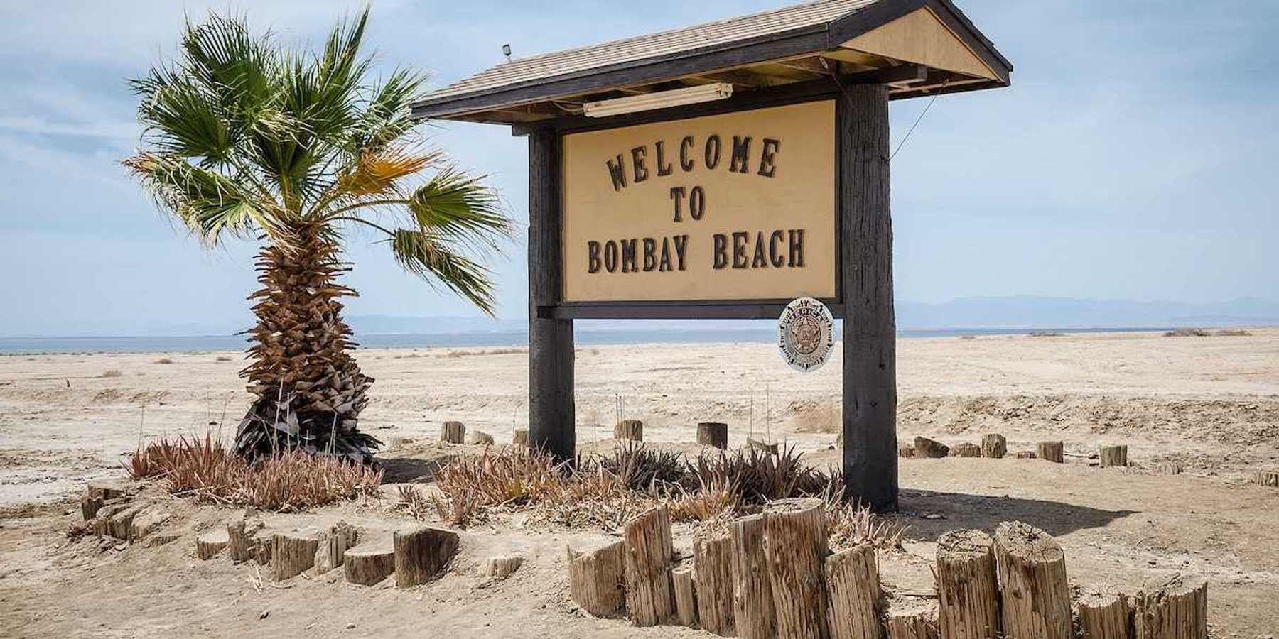 A sign welcomes visitors to Bombay Beach, a partially abandoned town on the shores of the Salton Sea.