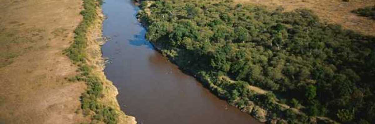 A small river winding through a dry environment