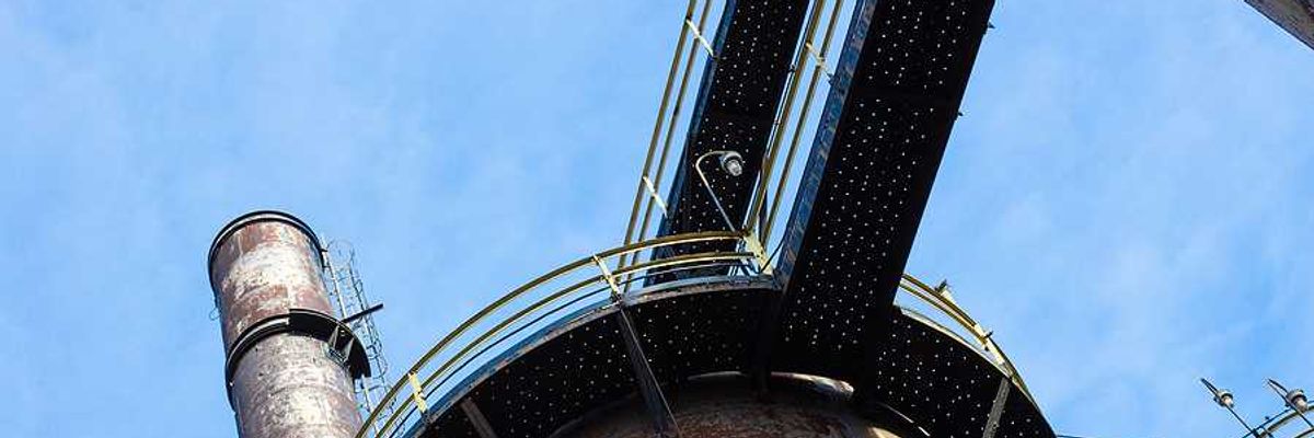 A smokestack viewed from below