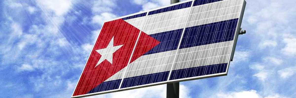 A solar panel installed on a pole imprinted with the Cuban flag
