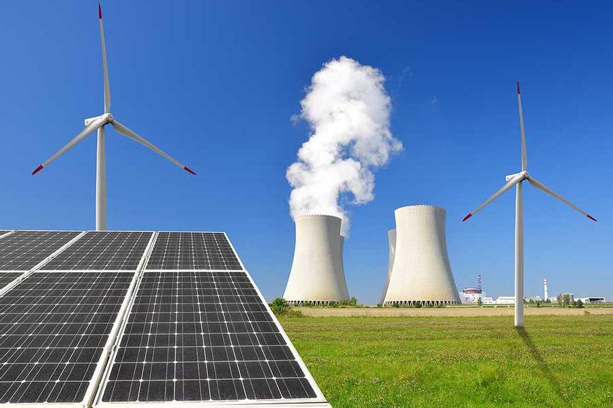 A solar panel with wind turbines and an energy plant in the background