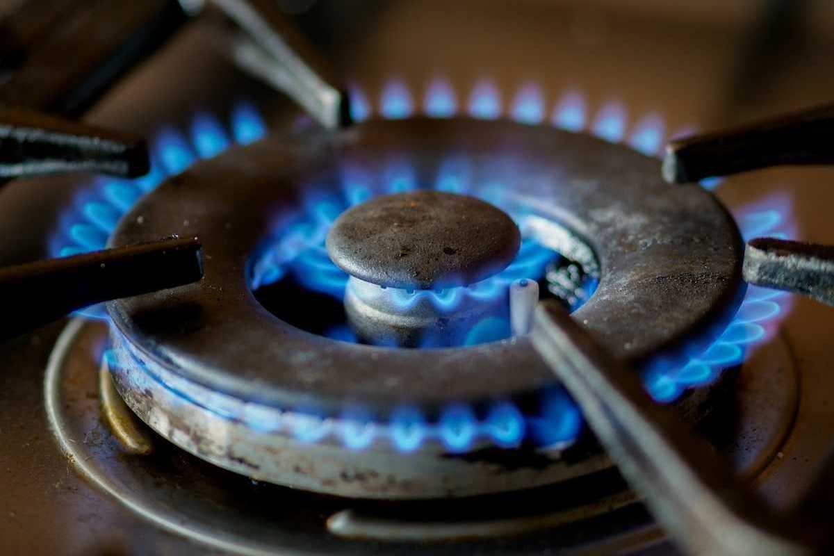 A somewhat-used lit burner on a gas stove