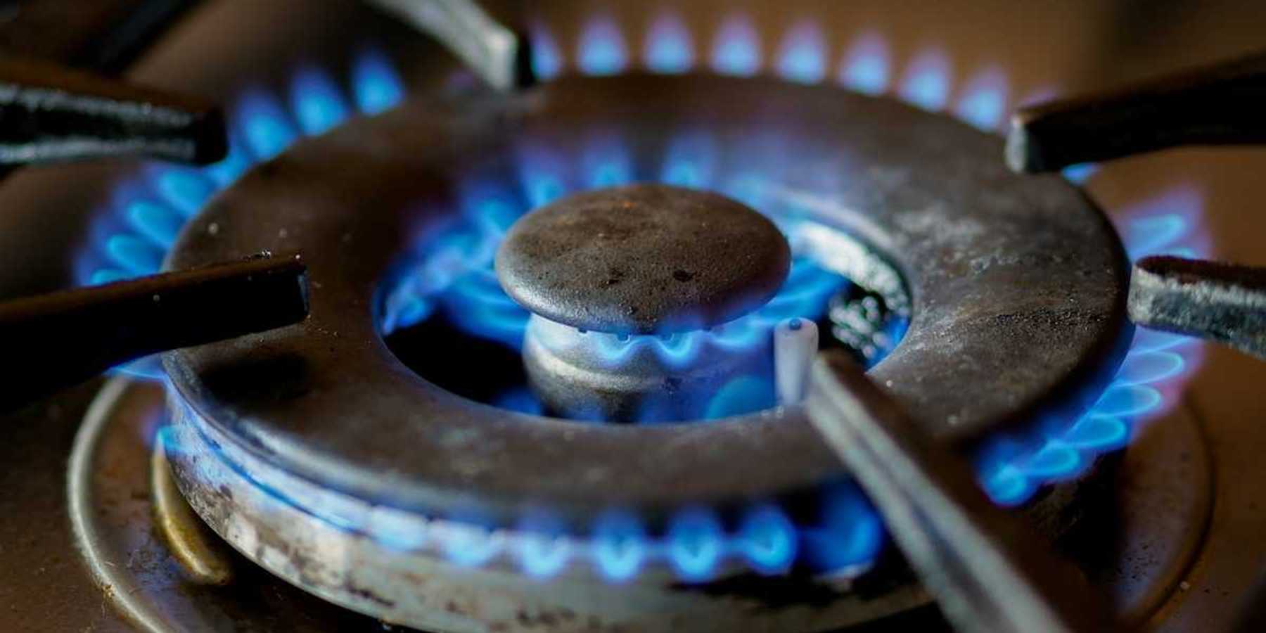 A somewhat-used lit burner on a gas stove