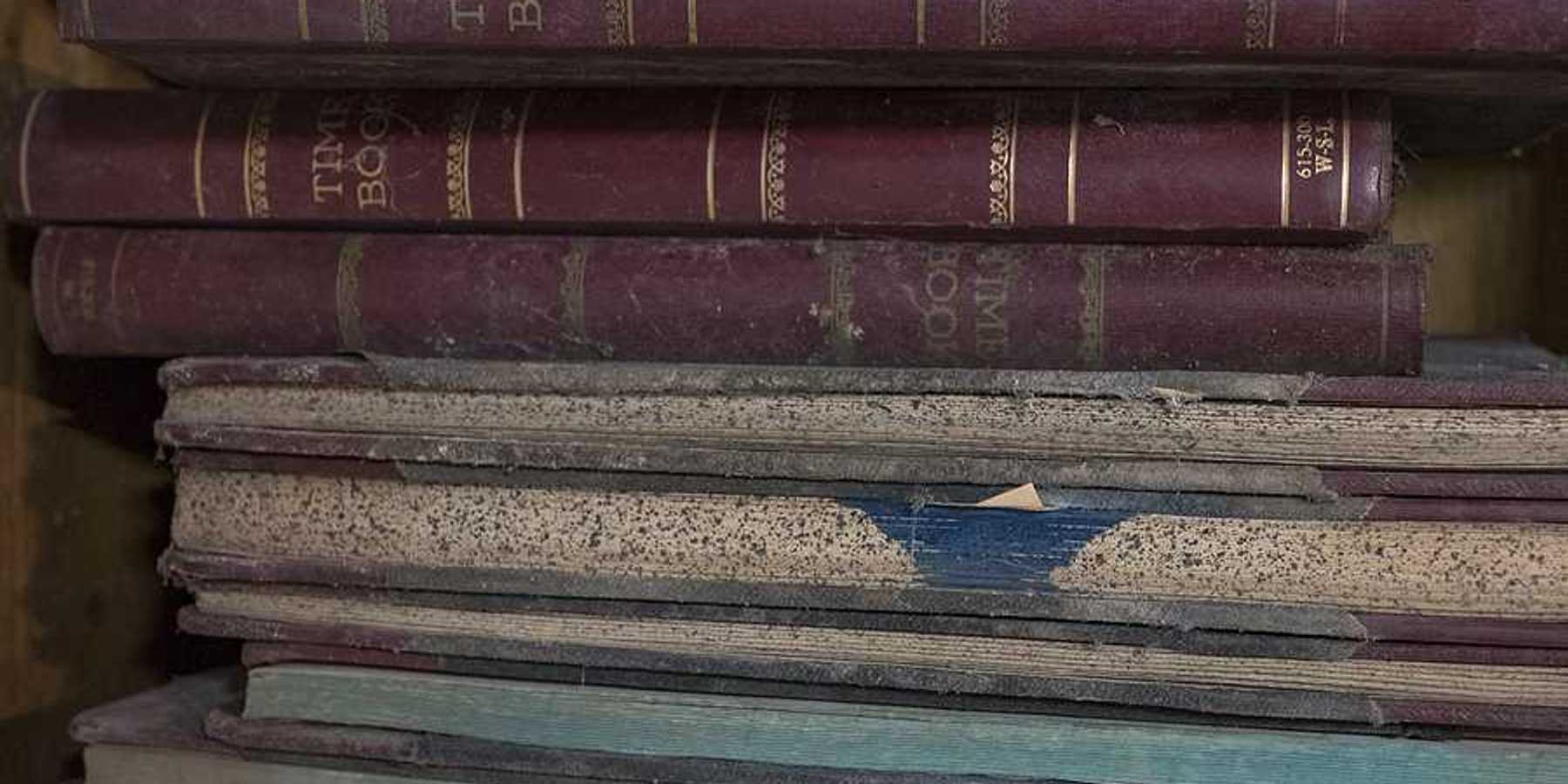 A stack of old ledger books