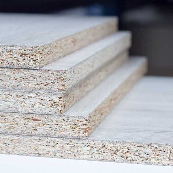 A stack of particle board viewed from the side