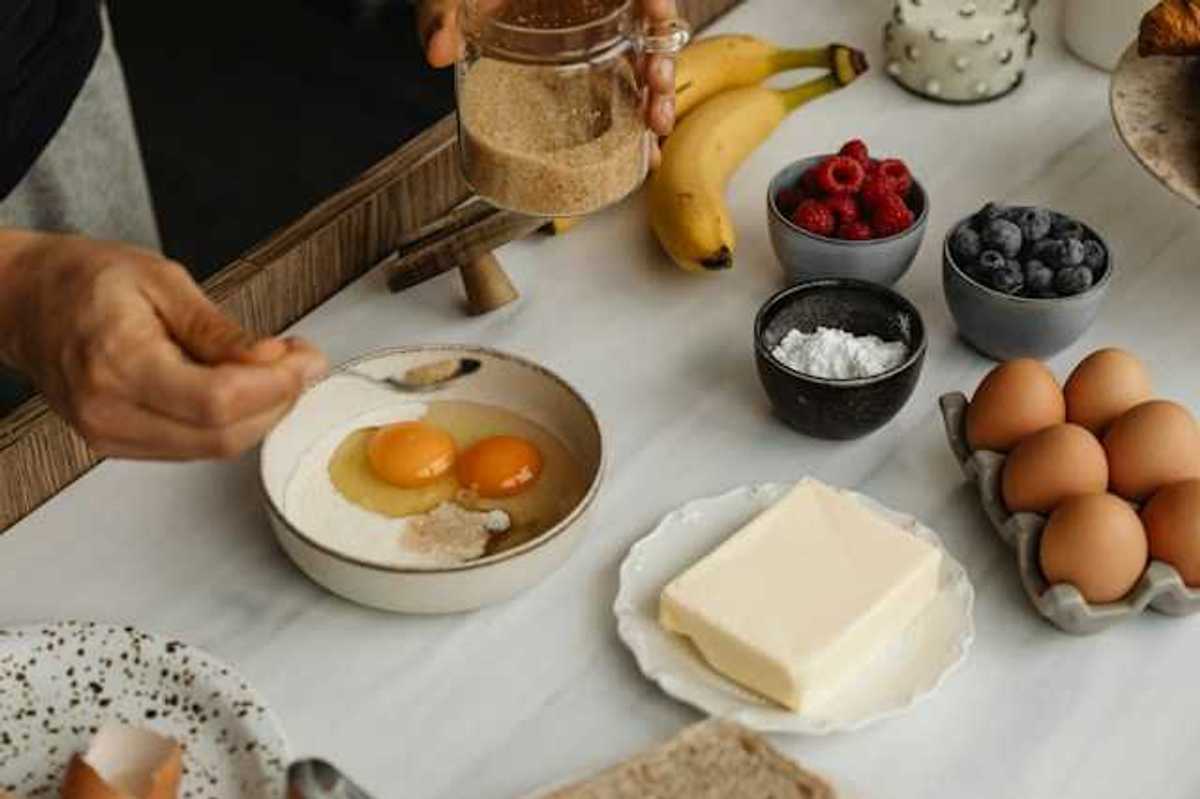 A table with types of food including eggs, butter and fruit
