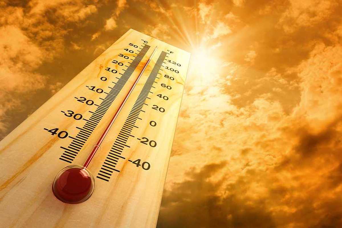 A thermometer pointing skyward towards a searing sun