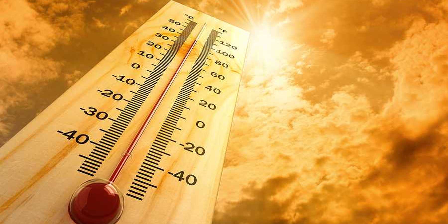 A thermometer pointing skyward towards a searing sun