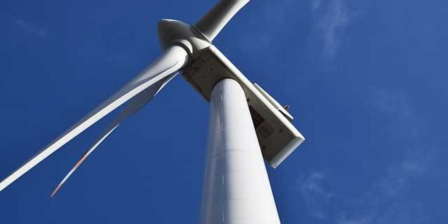 A view from below looking up at a wind turbine