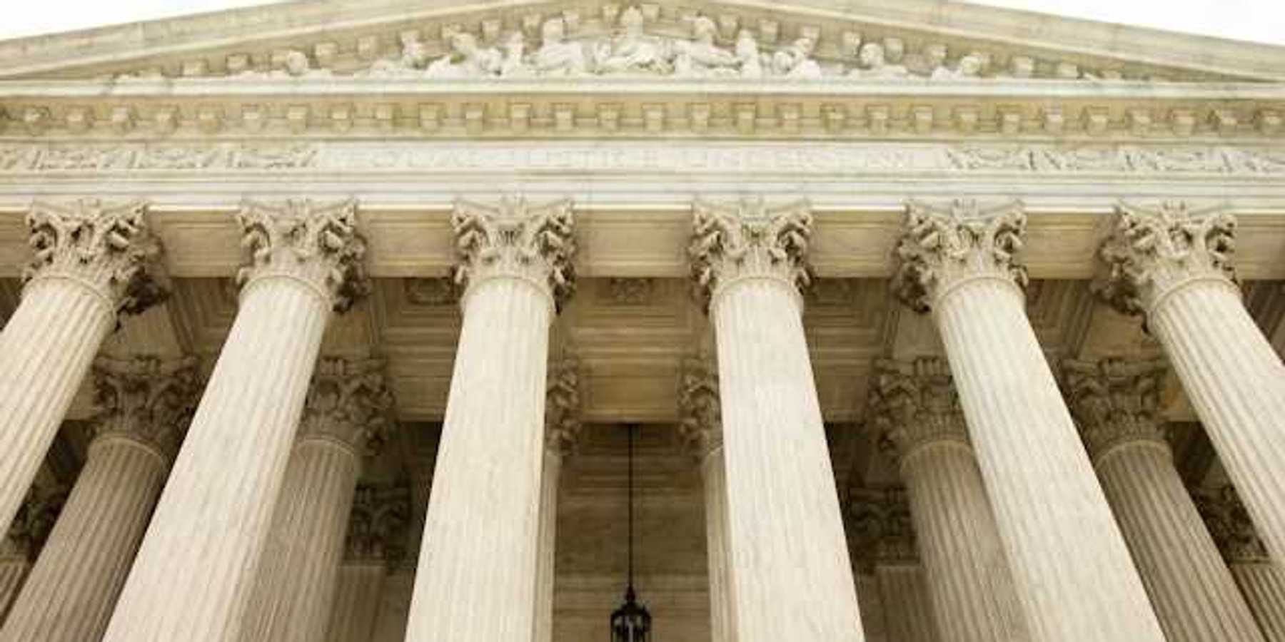 A view looking up at the facade of the Supreme Court building