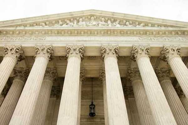 A view looking up at the facade of the Supreme Court building