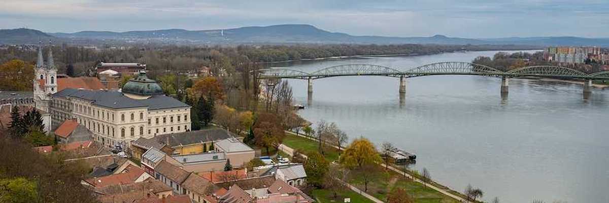 A view of a European city with a river next to it
