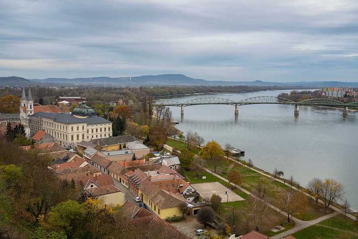 A view of a European city with a river next to it