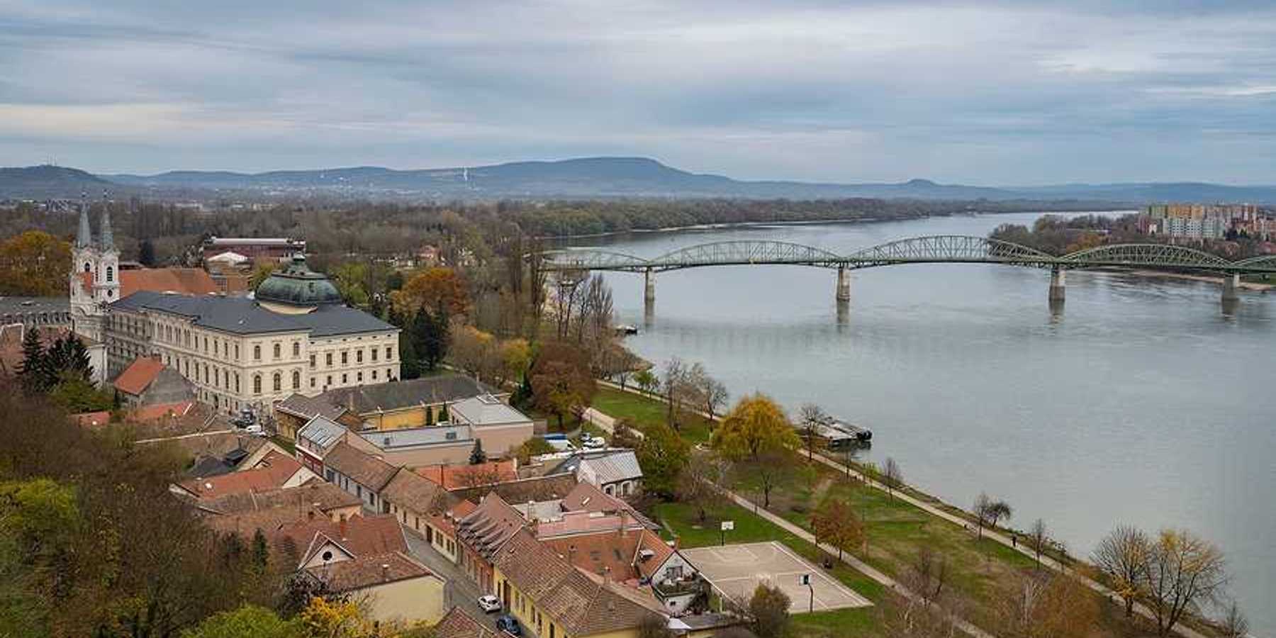 A view of a European city with a river next to it