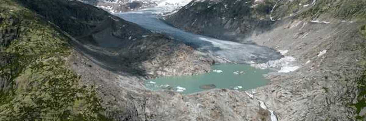 A view of a glacier retreating from a rocky landscape