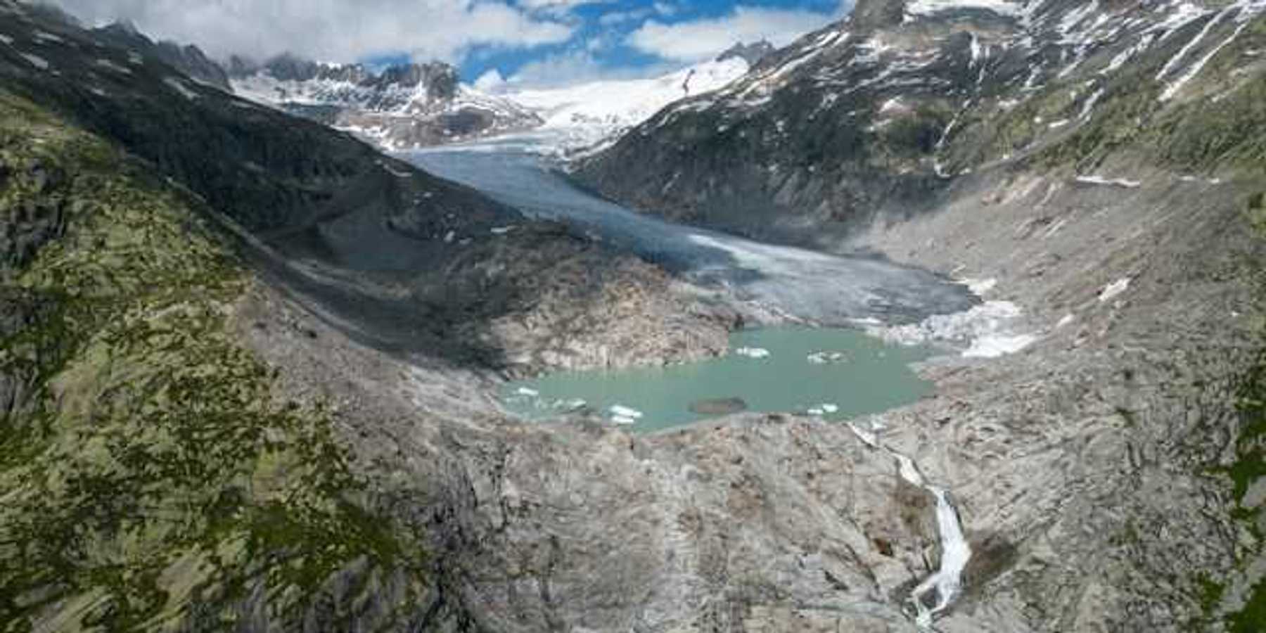 A view of a glacier retreating from a rocky landscape