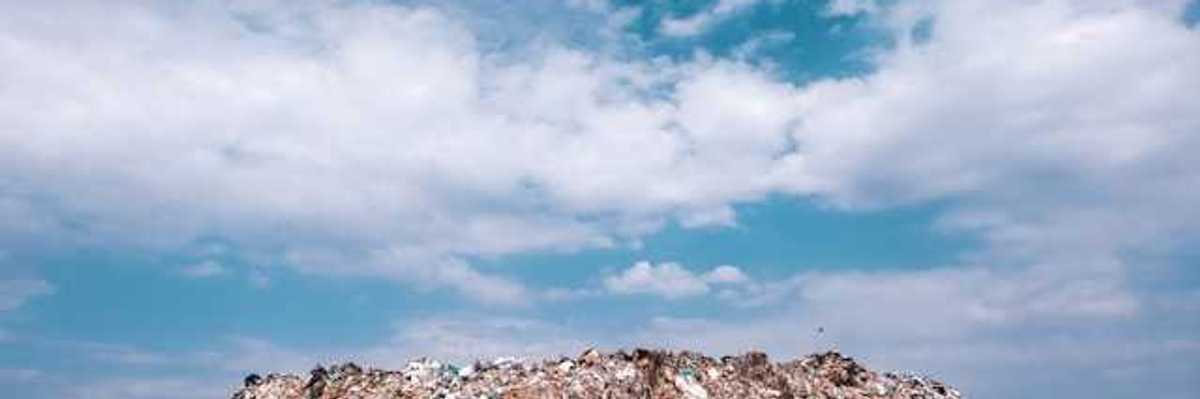 A view of a landfill against a blue sky