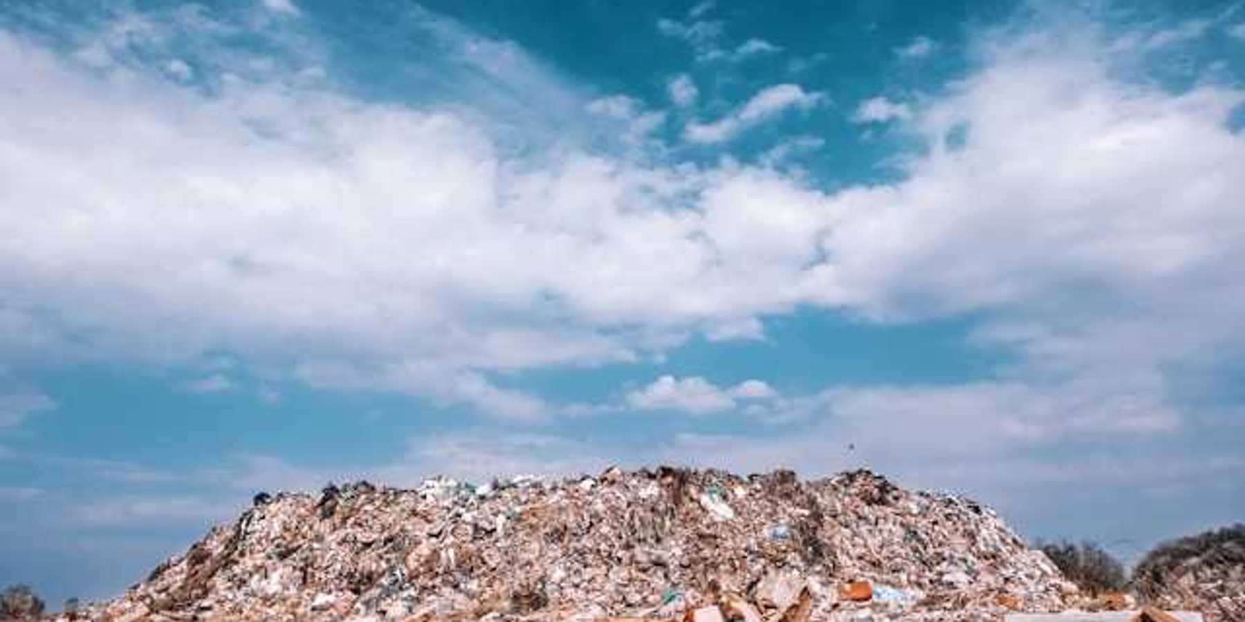 A view of a landfill against a blue sky