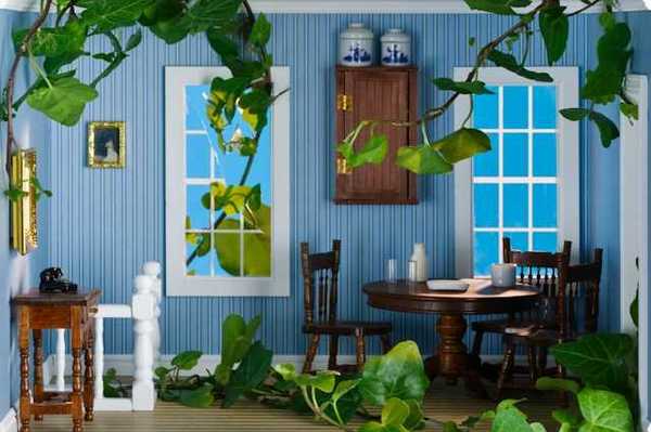 A view of a miniature living room with doll-sized furniture