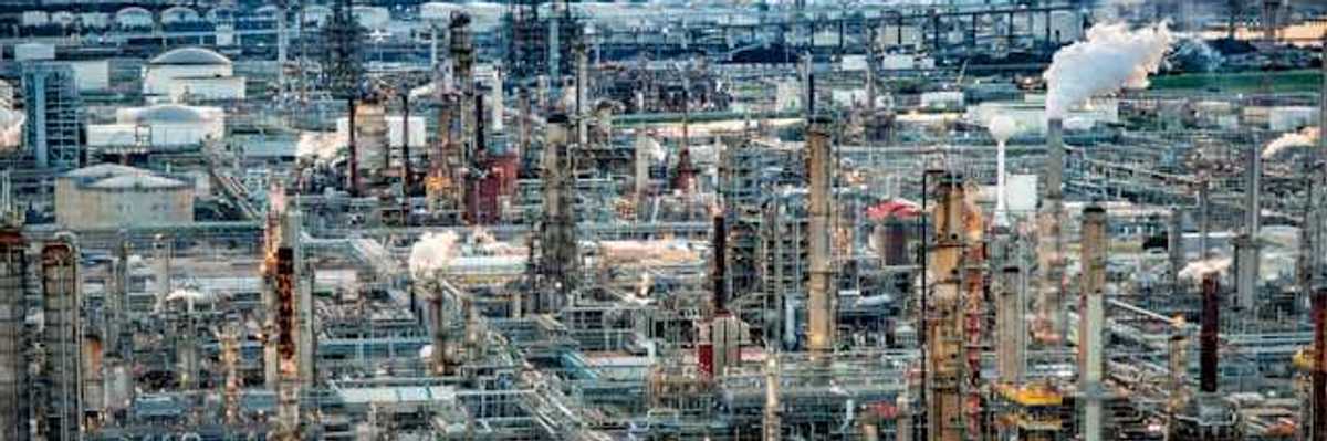 A view of a petrochemical plant with a skyline in the background