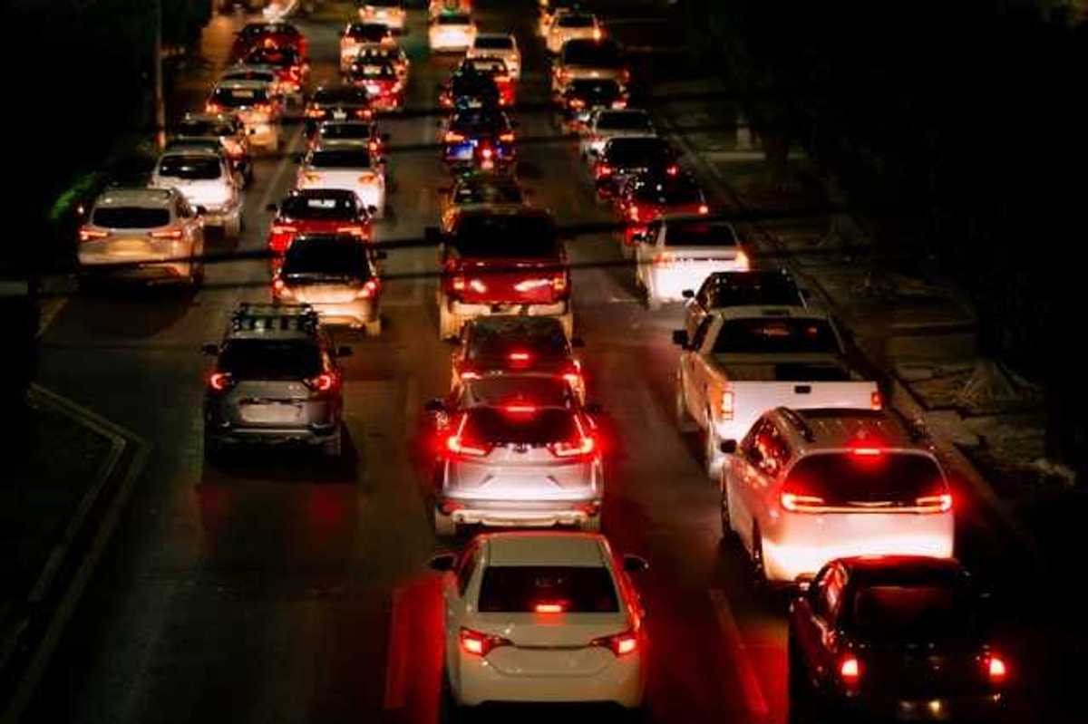 A view of a traffic jam with many cars and red brake lights