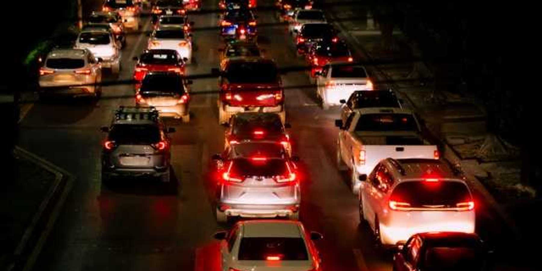 A view of a traffic jam with many cars and red brake lights