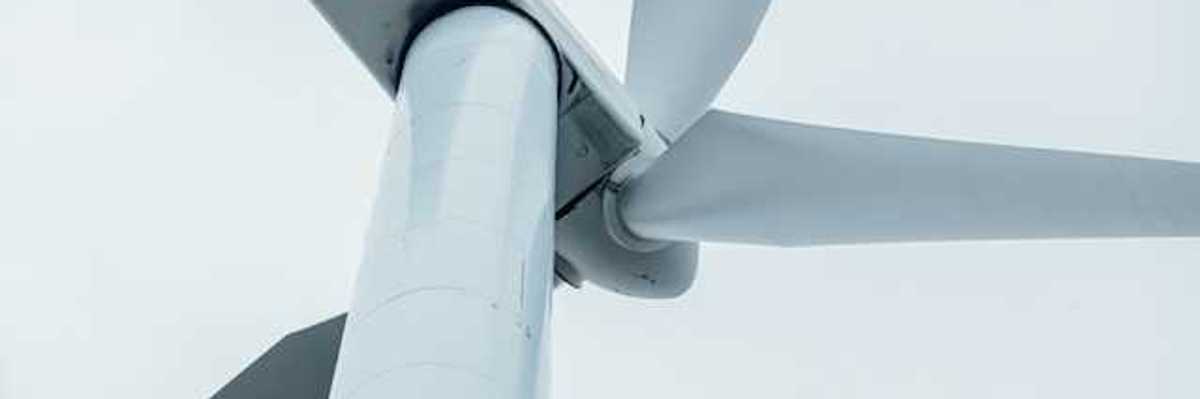A view of a wind turbine from below