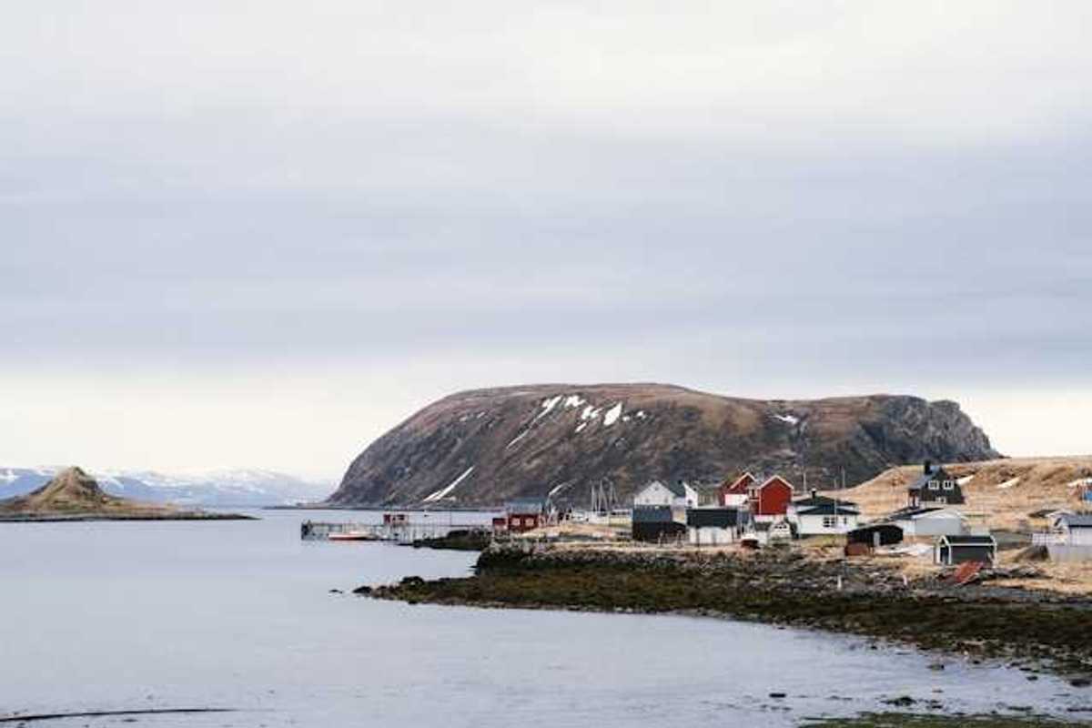 A view of an Alaskan village on the edge of a body of water