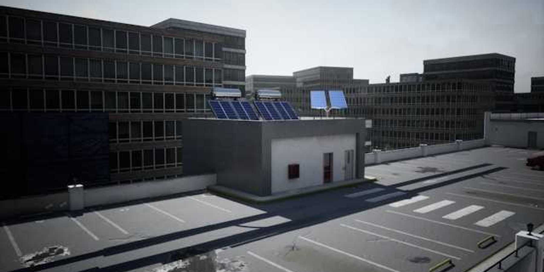 A view of an office building roof with solar panels on it