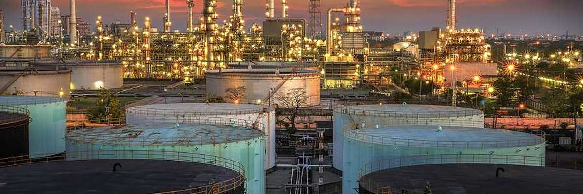 A view of an oil refinery at sunset