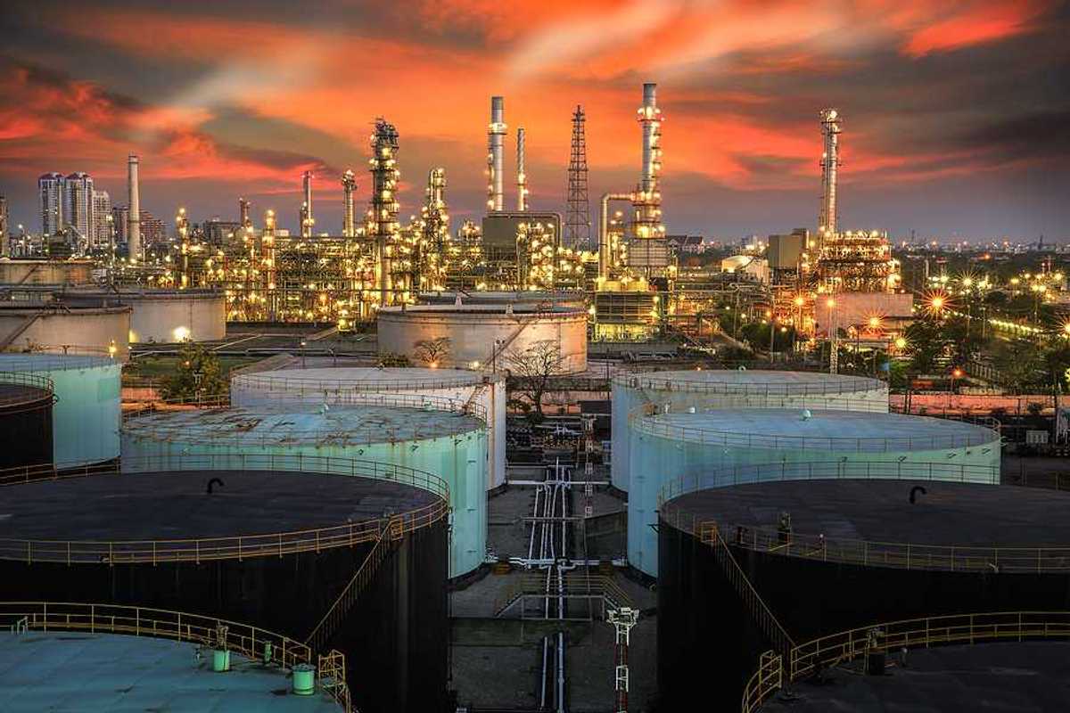 A view of an oil refinery at sunset