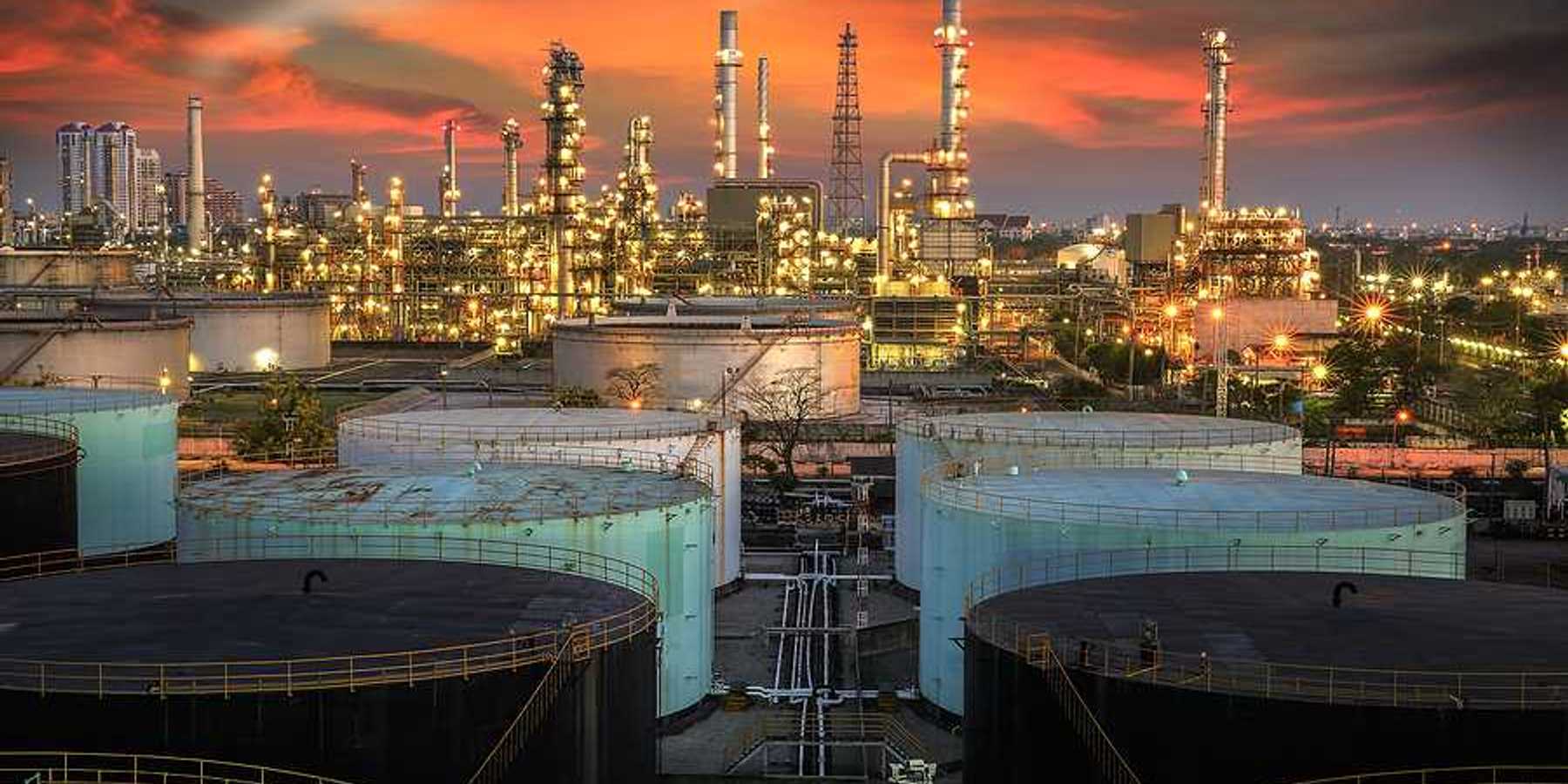 A view of an oil refinery at sunset