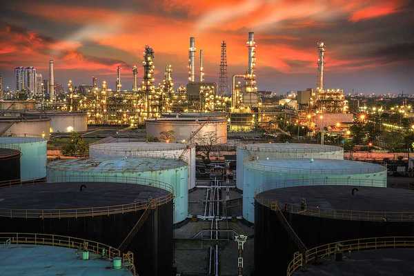 A view of an oil refinery at sunset