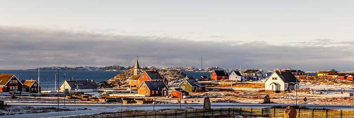 A view of houses in a wintry landscape