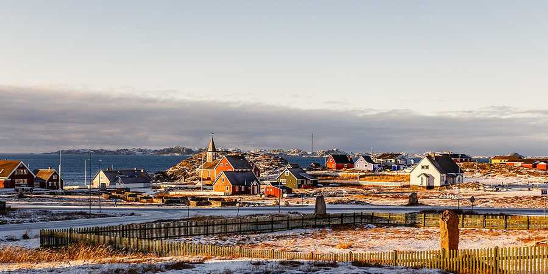 A view of houses in a wintry landscape