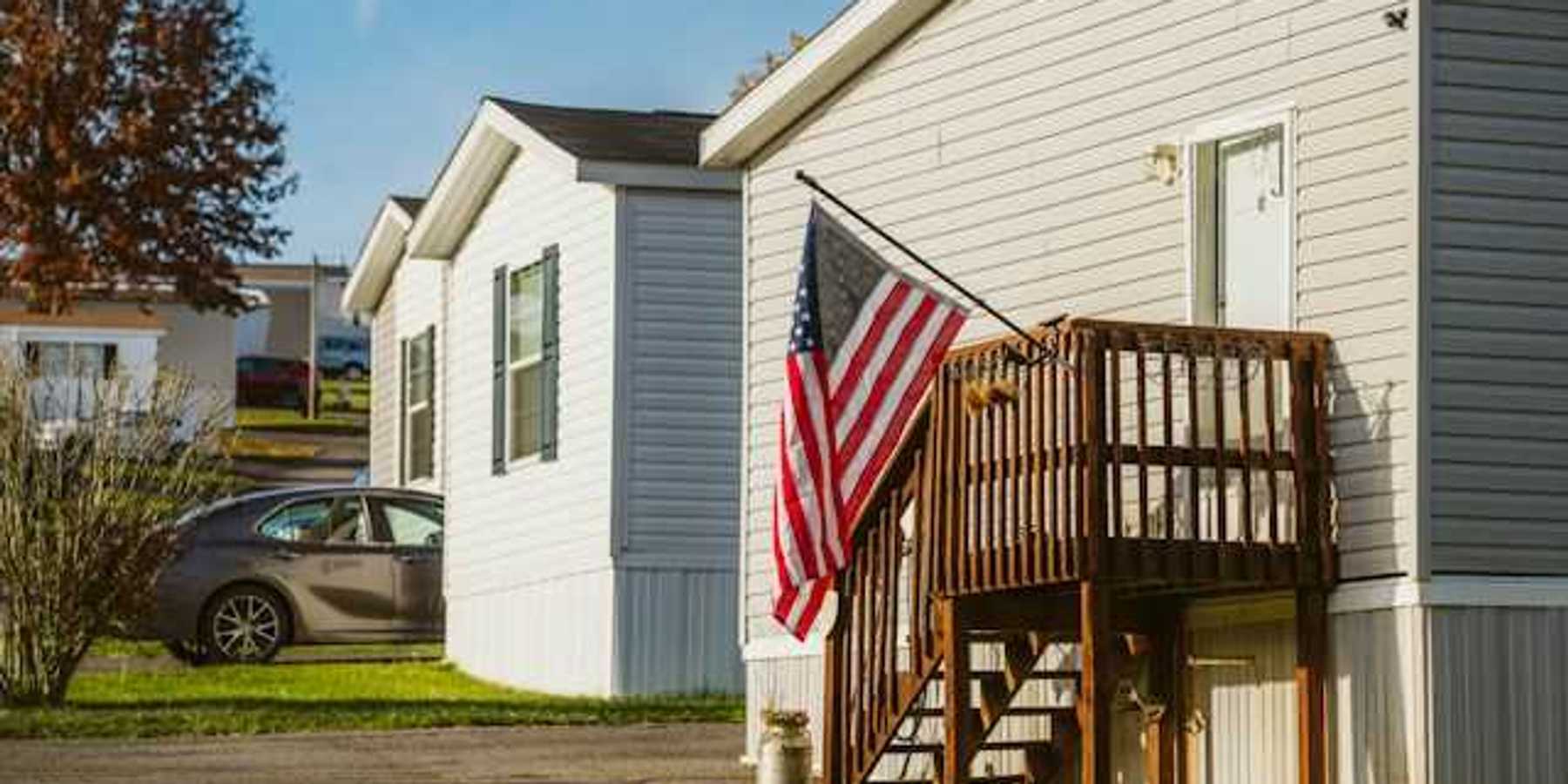 A view of manufactured homes with a U.S. flag flying outside