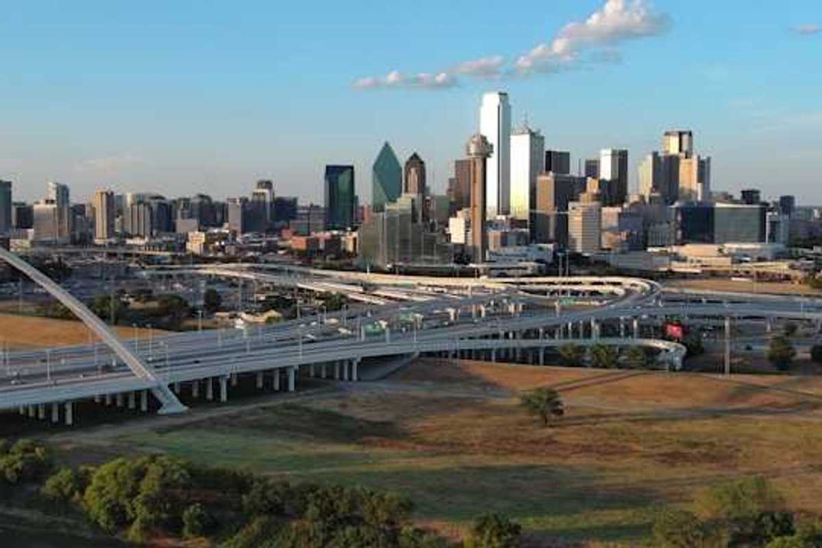 A view of the Dallas skyline with freeways in the foreground