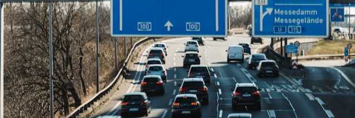 A view of the German autobahn with blue city signs
