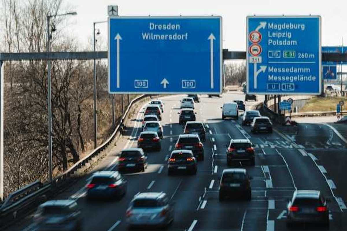 A view of the German autobahn with blue city signs