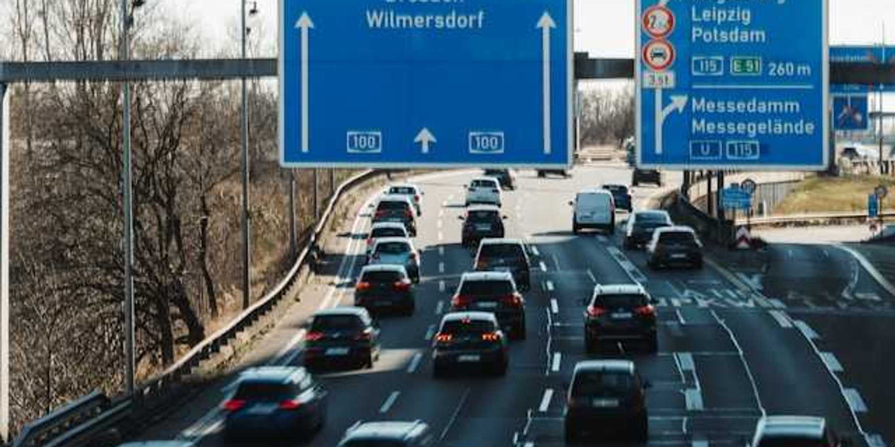 A view of the German autobahn with blue city signs