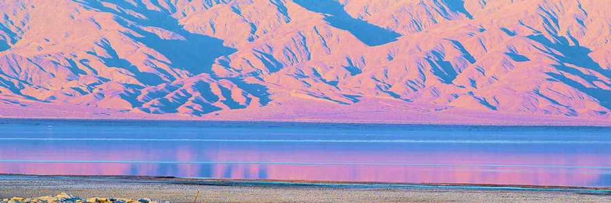 A view of the Salton Sea with mountains in the background